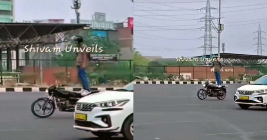 Stunt standing on a bike